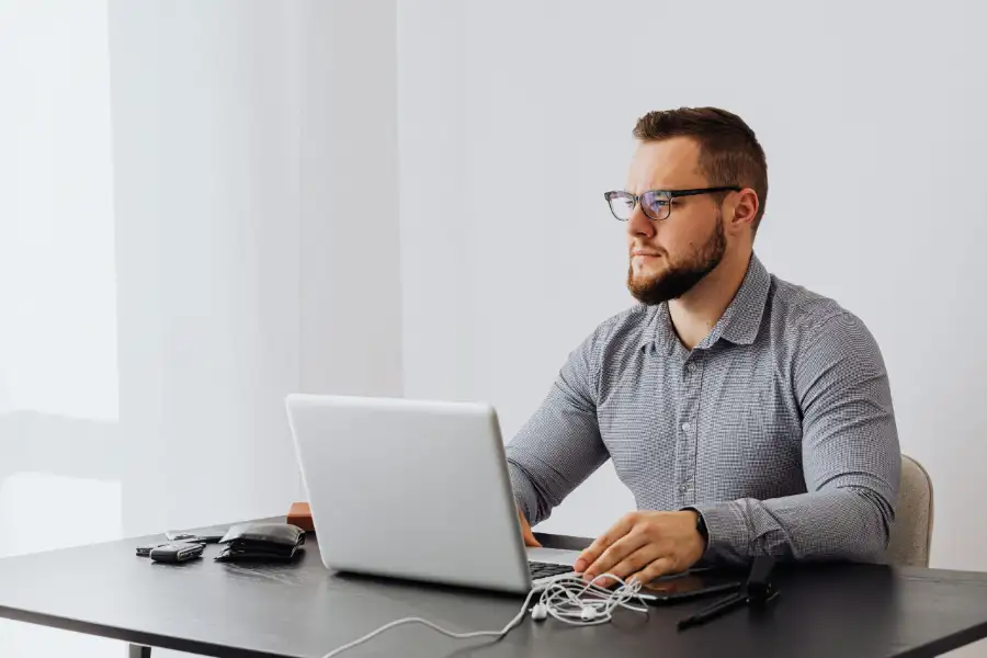 Business owner reviewing financing options on a laptop