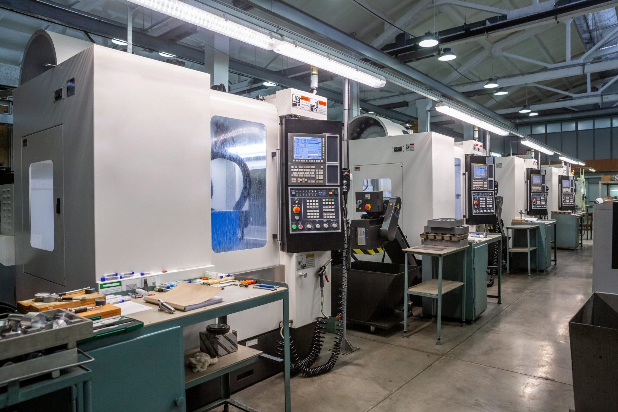 Modern CNC machines on a manufacturing floor