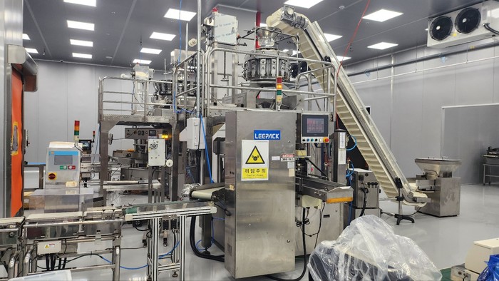 Food packaging machinery on a clean production floor