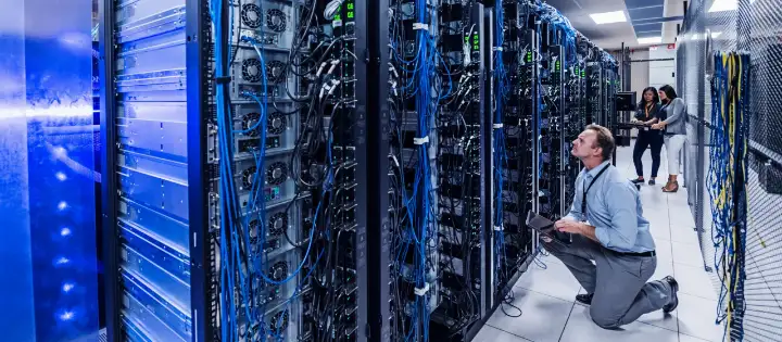 IT professional working in a modern server room